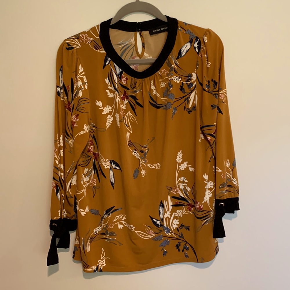 Soft and flowy blouse by IVANKA TRUMP.